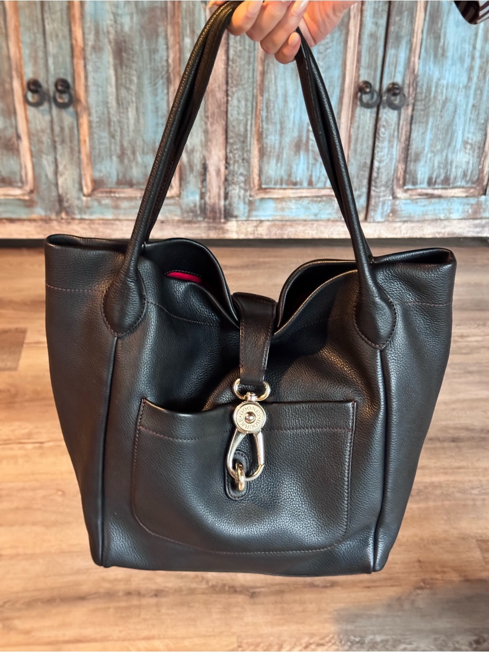 Dooney & Bourke Black Leather Tote with Gold Hardware and Red Interior Accent